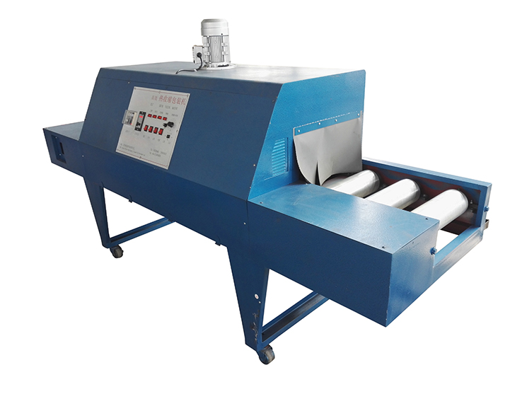 Heat shrinkable film packaging machine